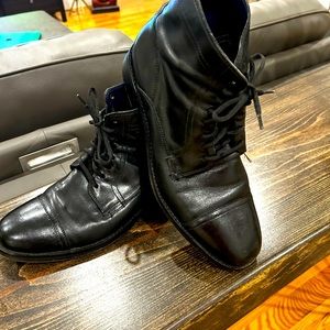 Captoe Cole Hann black boots.